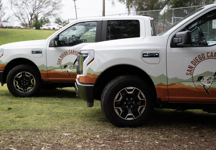 Two of the electric vehicles, side-by-side, that were donated to San Diego Canyonlands.
