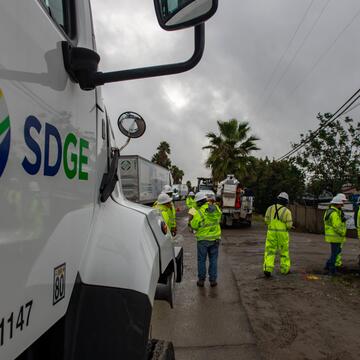SDG&E field crews inspecting a damaged power pole