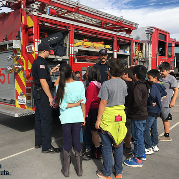 Picture of Fire Safe Kids Program - firefighter interacting with kids 