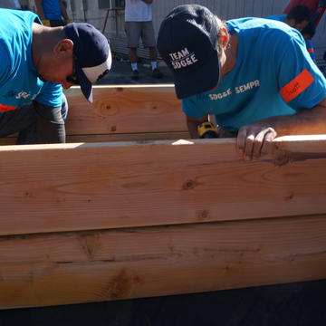 SDG&E employees putting together a raised garden bed