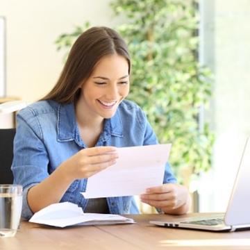 Customer smiling while looking at her bill