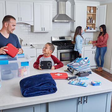 Family putting together an emergency kit