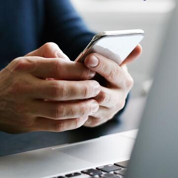 someone holding their mobile phone.